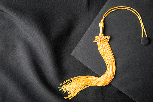 2022 grads will wear tassels on their caps that represent their area of study. Photo credit: istock photo