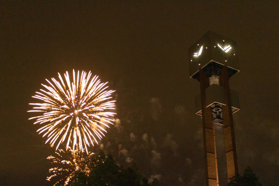 Weber State University clock tower with fireworks behind it on July 17, 2022. (Kennedy Robins/ The Signpost)