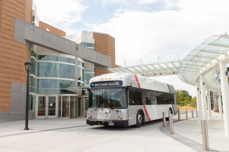 A UTA bus parked in front of the Browning Center building.