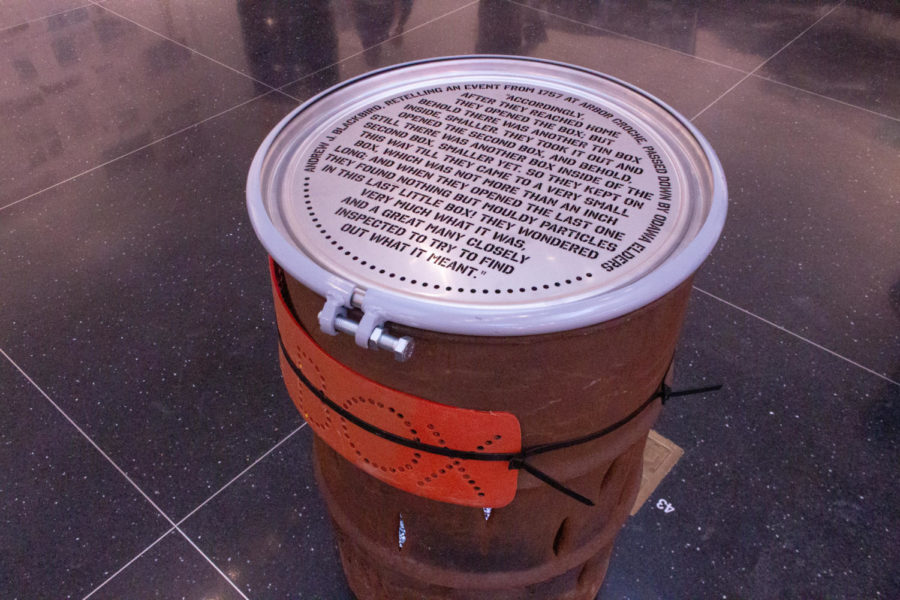 An art piece called Tin Box, which was made with a burn barrel, zip ties, laser-cut stainless steel drum and a video production.