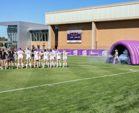 Sadie Noble joins her teammates on the field in a photo taken during a game in 2019.