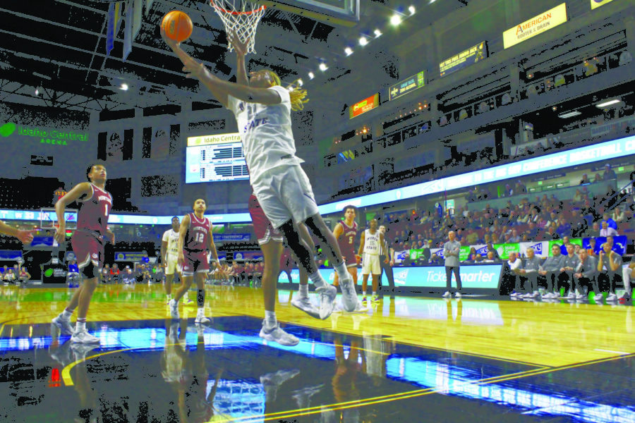 Dontay Bassett goes for a layup against the Montana Griz.