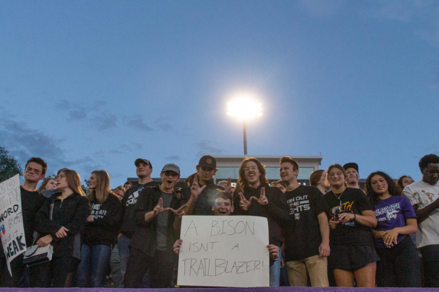 Students posing for a photo in the student section. (Kennedy Camarena/ The Signpost)
