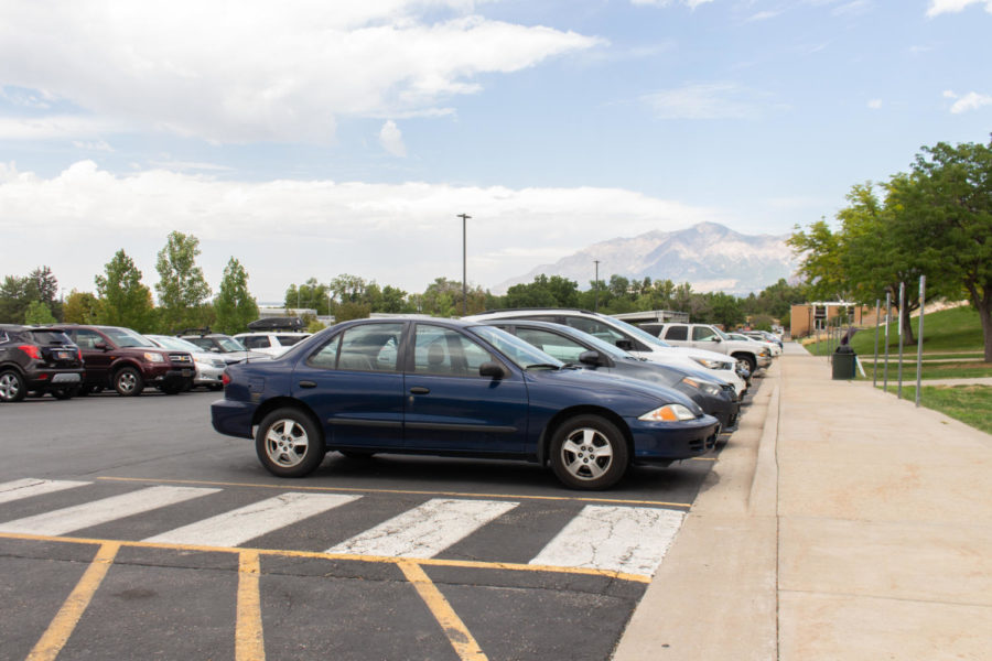 Cars parked at a parking lot located at the bottom of Ogden campus.