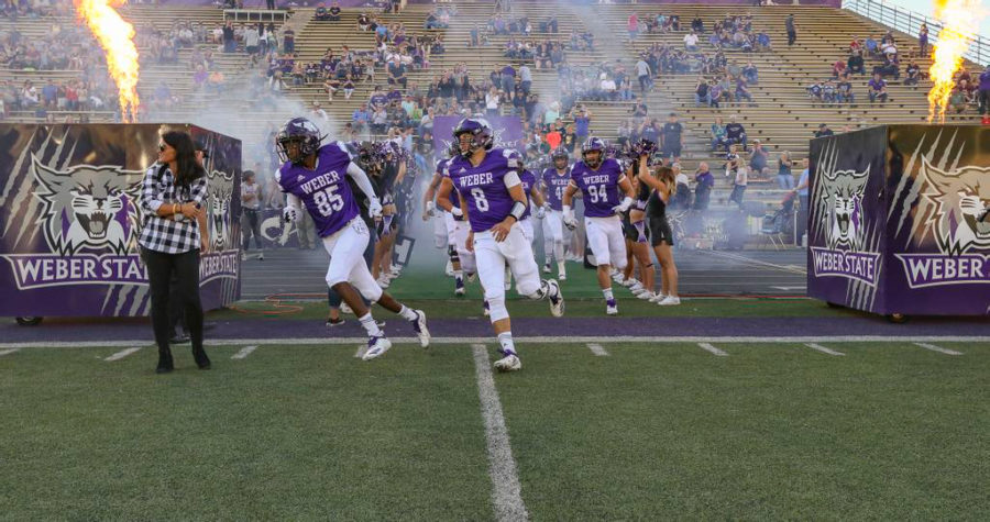 WSU football team running out onto the field during their game with Northern Colorado. (Weber State Athletics)