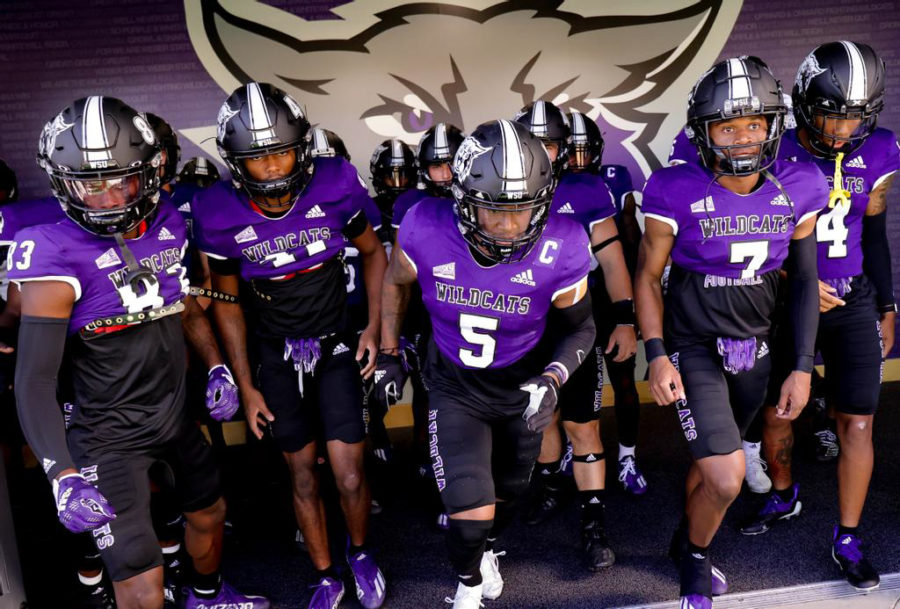 Weber+State+University+football+team+runs+onto+the+field+for+their+season+opener+against+Western+Oregon+on+Sept.+1.+The+Wildcats+are+ranked+5th+in+the+FCS.