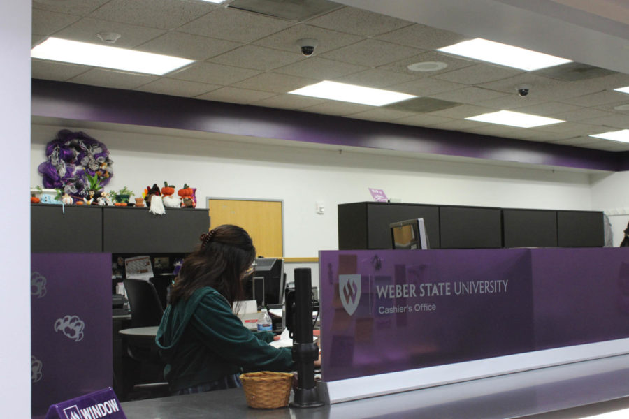 Mireya Garcia working in the Cashiers office in the Student Services Center.