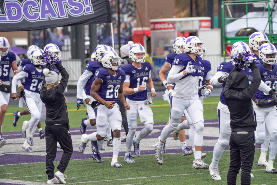 Weber State football team running onto the field for their game against Sacramento State.
