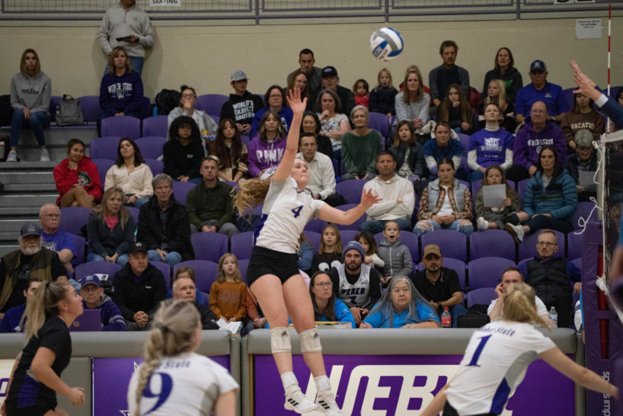Makayla Sorensen jumping for the volleyball at the game against Montana State.