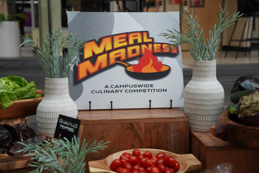 Meal madness sign surrounded by ingredients used in the competition.