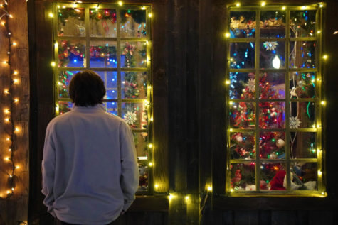 Weber student looking into a Christmas booth.