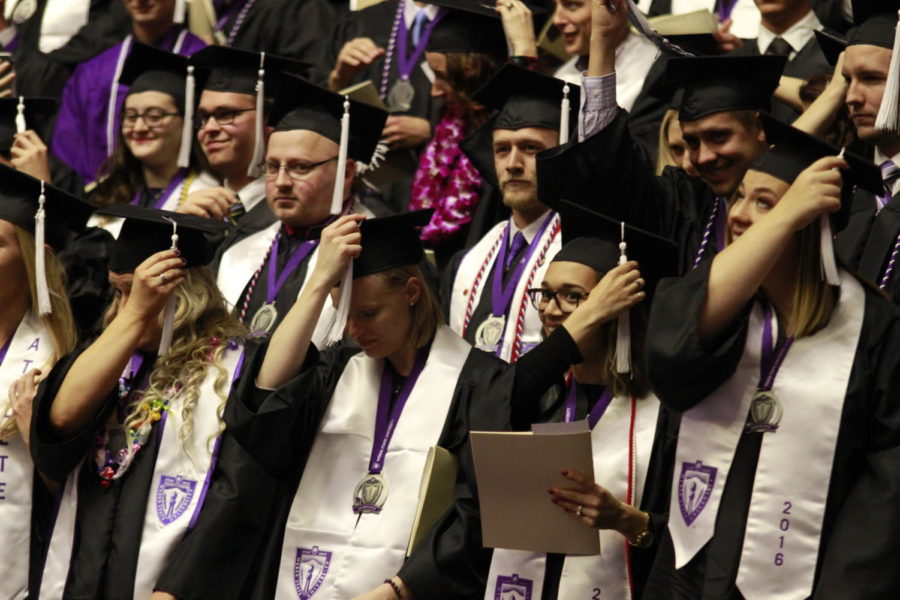 Students flipping their tassels as they graduate. Photo taken in 2016.