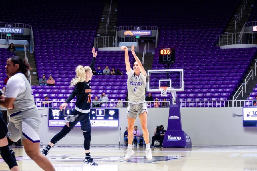 Wildcat+Laura+Taylor+%280%29+attempts+a+free+throw+as+an+Idaho+State+player+tries+to+block+their+shot+on+Jan+30.