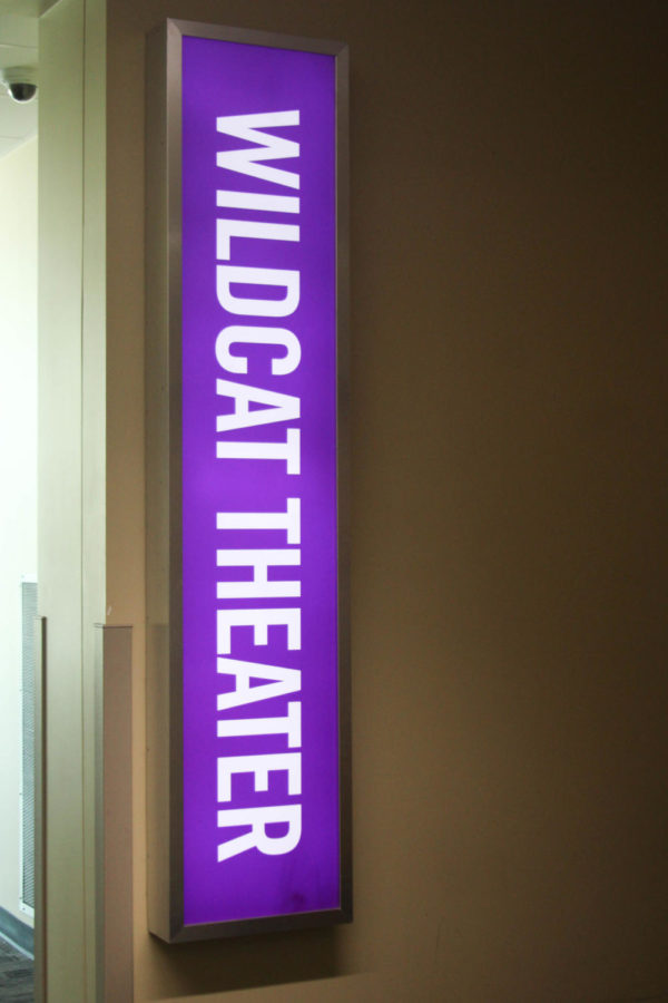 The lit up Wildcat Theater sign in the hallway outside to lead the way to the theater.