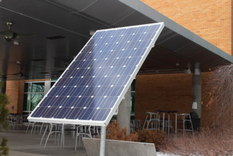 A single solar panel sitting outside of the Shepherd Union building.