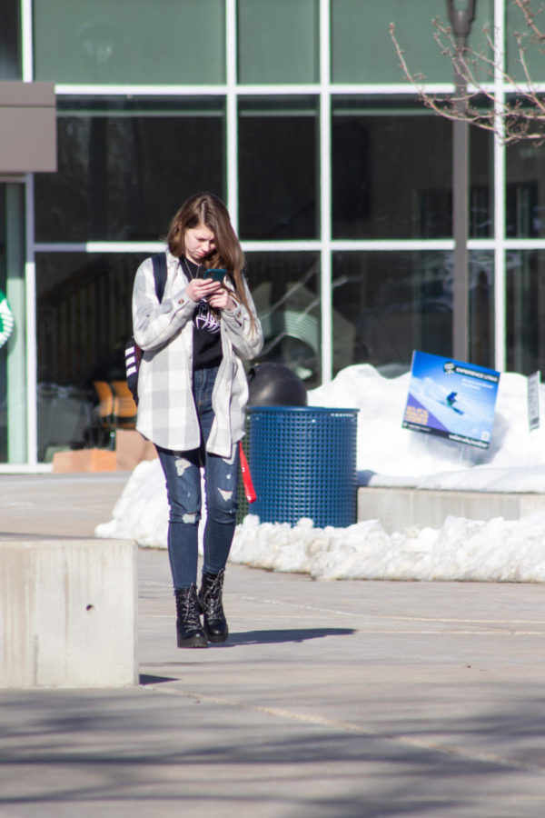 WSU student Sara Allen bundled up against the cold on the way to class.