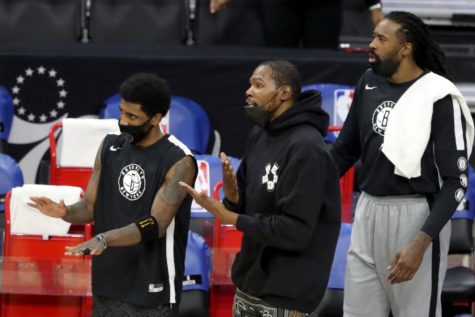 Kevin Durant (middle), Kyrie Irving (left) and James Harden in a lineup.