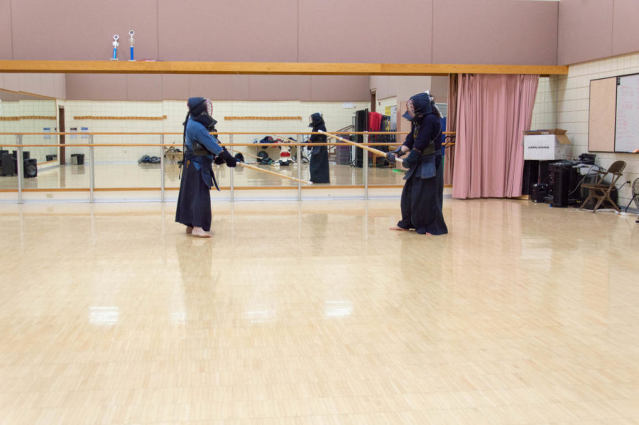 Kolby Doxy and his instructor David Diguangco sparring.