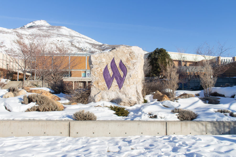 The W rock on Ogden campus stands out from the snowy mountains.