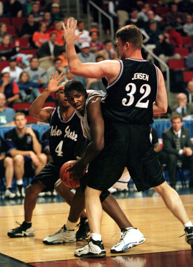 North Carolinas Brendan Haywood struggles to get by Weber States Eddie Gill (4) and Andy Jensen in Webers 76-74 victory Thursday, March 11, 1999.
