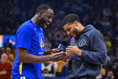 Golden State Warriors Draymond Green (23) hands Portland Trailblazers Gary Payton II (00) his 2022 NBA Championship ring during a pre-game ceremony before their NBA game at the Chase Center in San Francisco, Calif., on Friday, Dec. 30, 2022.