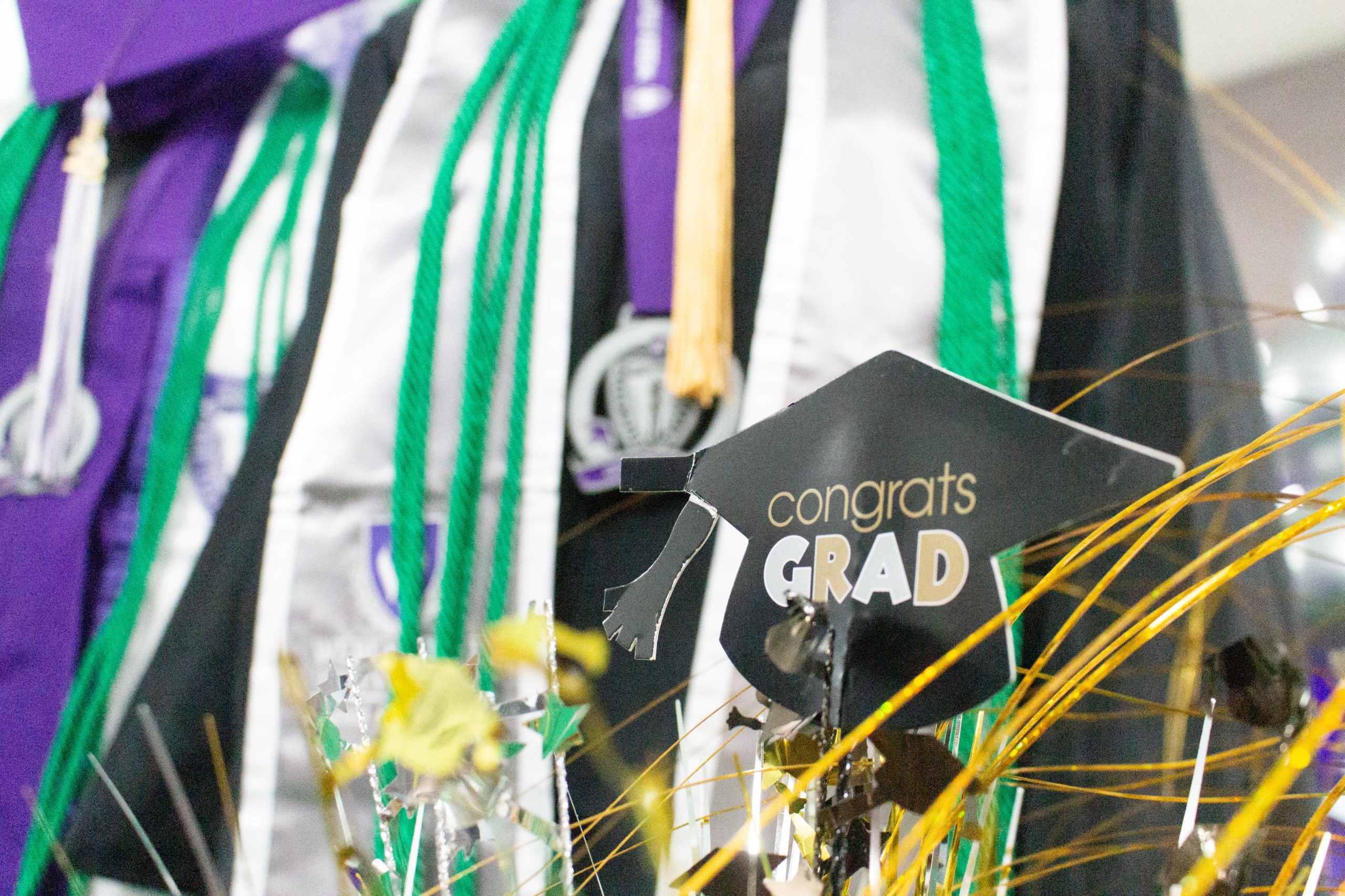 Decorations set out at grad finale along with graduation attire. Photo taken in December 2022.