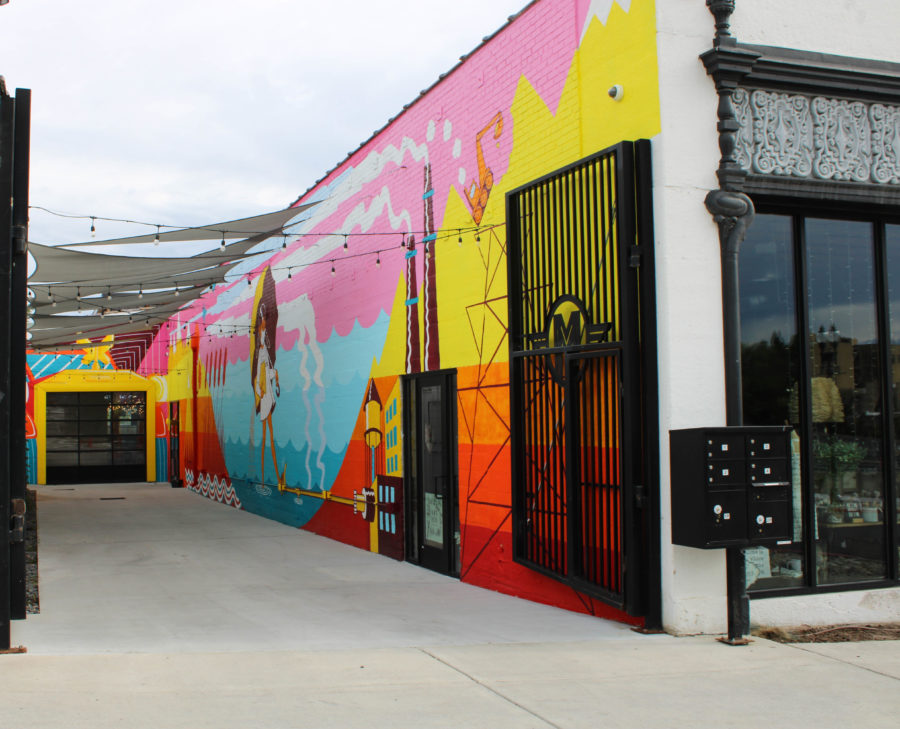 Murals seen lining the walls of the alleyway of the Monarch Art building.