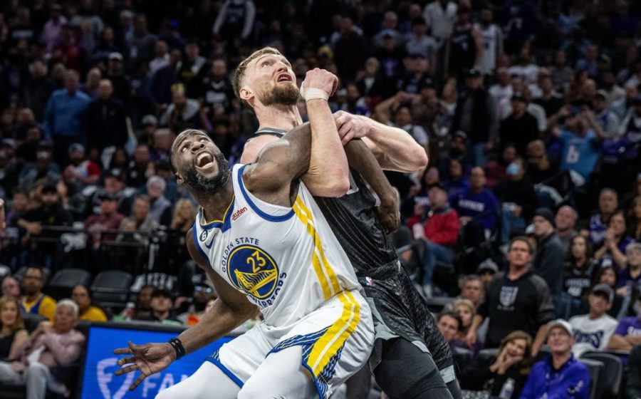 Golden State Warriors forward Draymond Green (23) and Sacramento Kings center Domantas Sabonis (10) get tangled up as they look for the ball during Game 2 of the first-round NBA playoff series at Golden 1 Center on April 17.