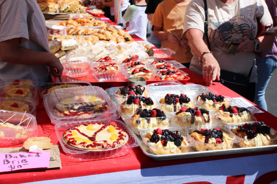 Customers purchasing freshly baked pastries made by Volkers Bakery at the Farmers Market.
