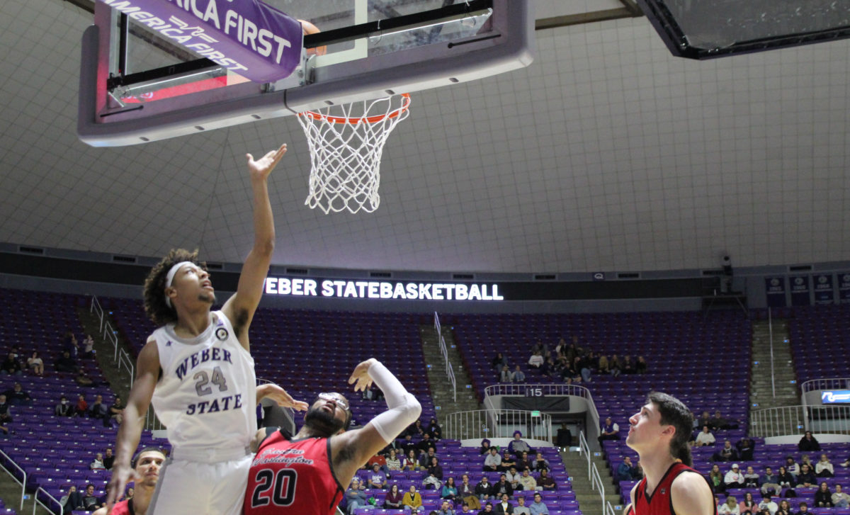 Jamison Overton gets a clean layup into the basket, scoring a point for Weber State. Photo taken in 2022.