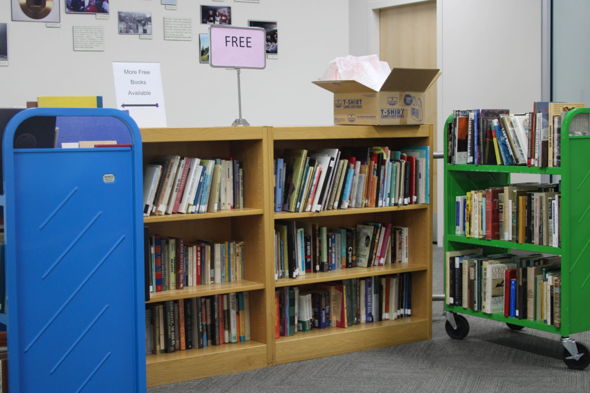 A bookshelf located at the front of Stewart Library, filled with free books available for students.