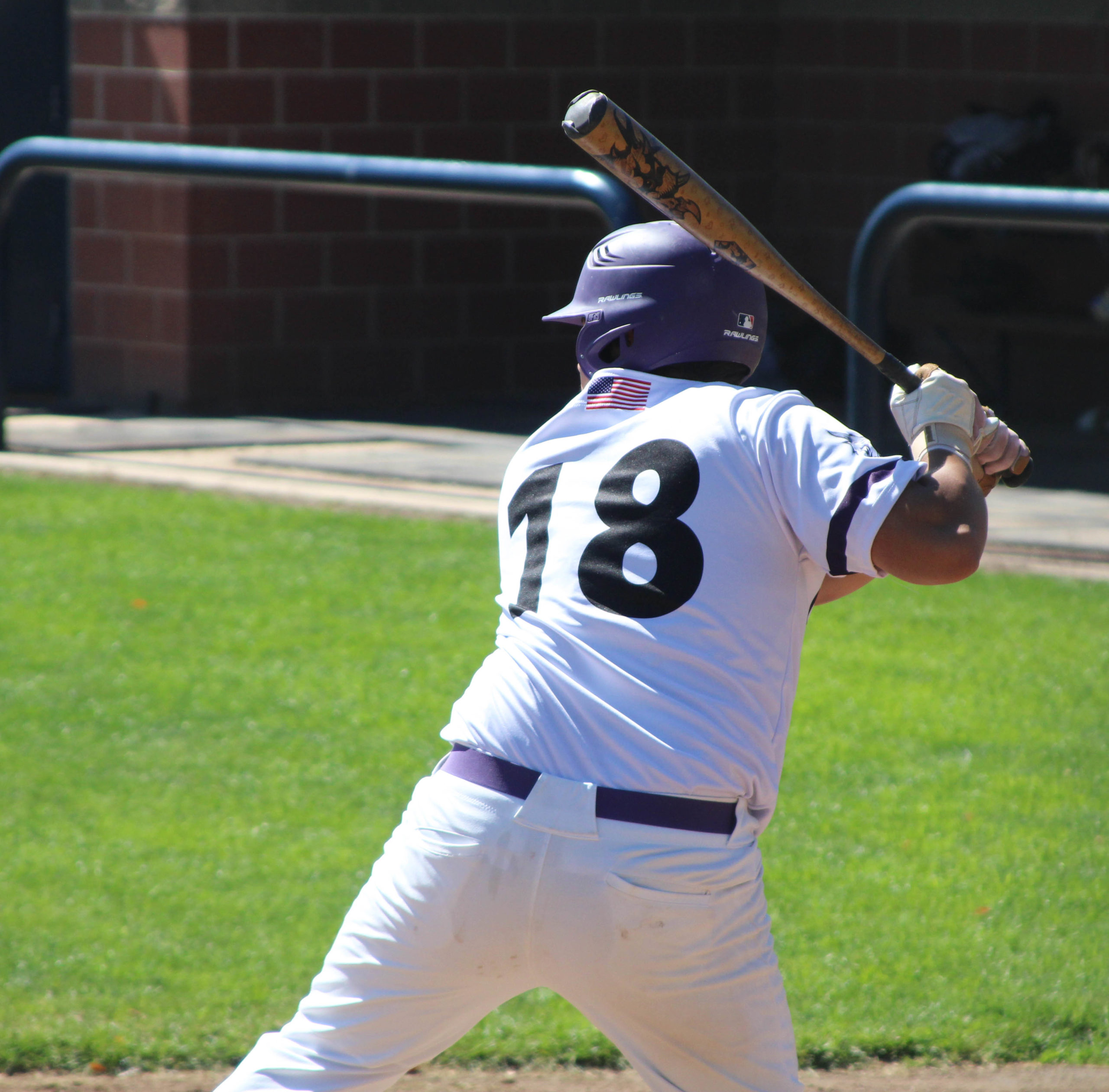 Weber State Mens Club Baseball, Estabon Romero (18), getting prepared to hit the ball as it is about to be pitched.