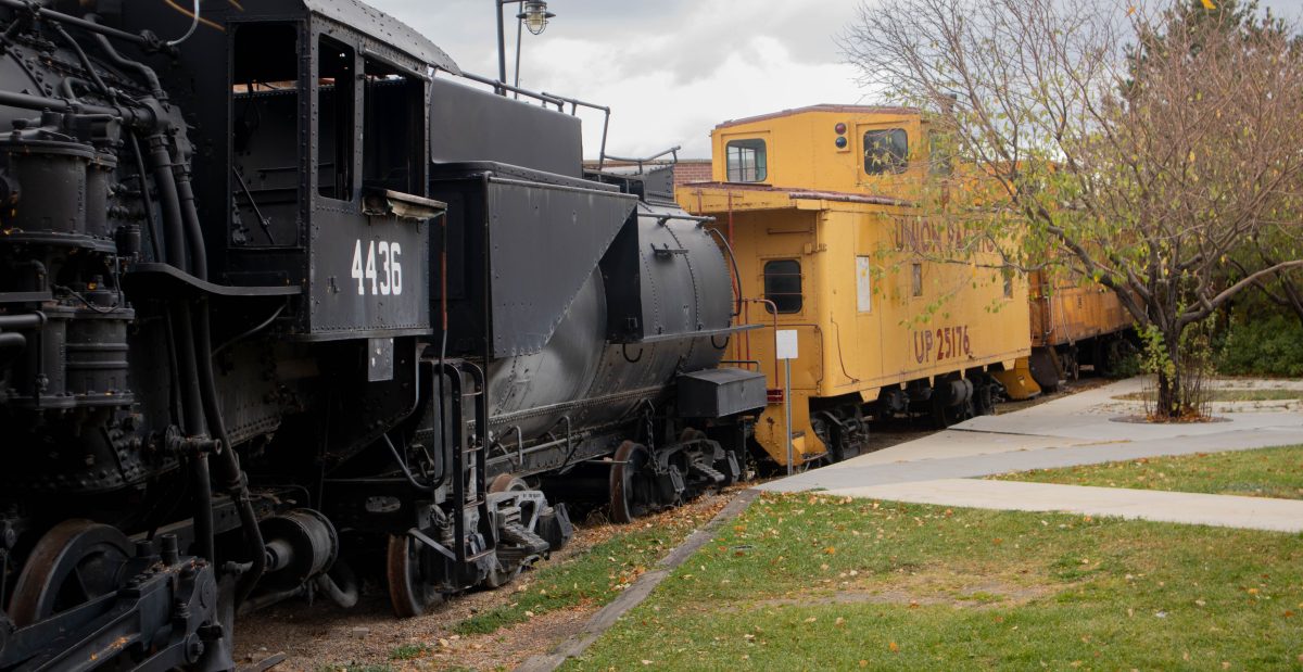 A locomotive train engine on display outside of the Union Station.
