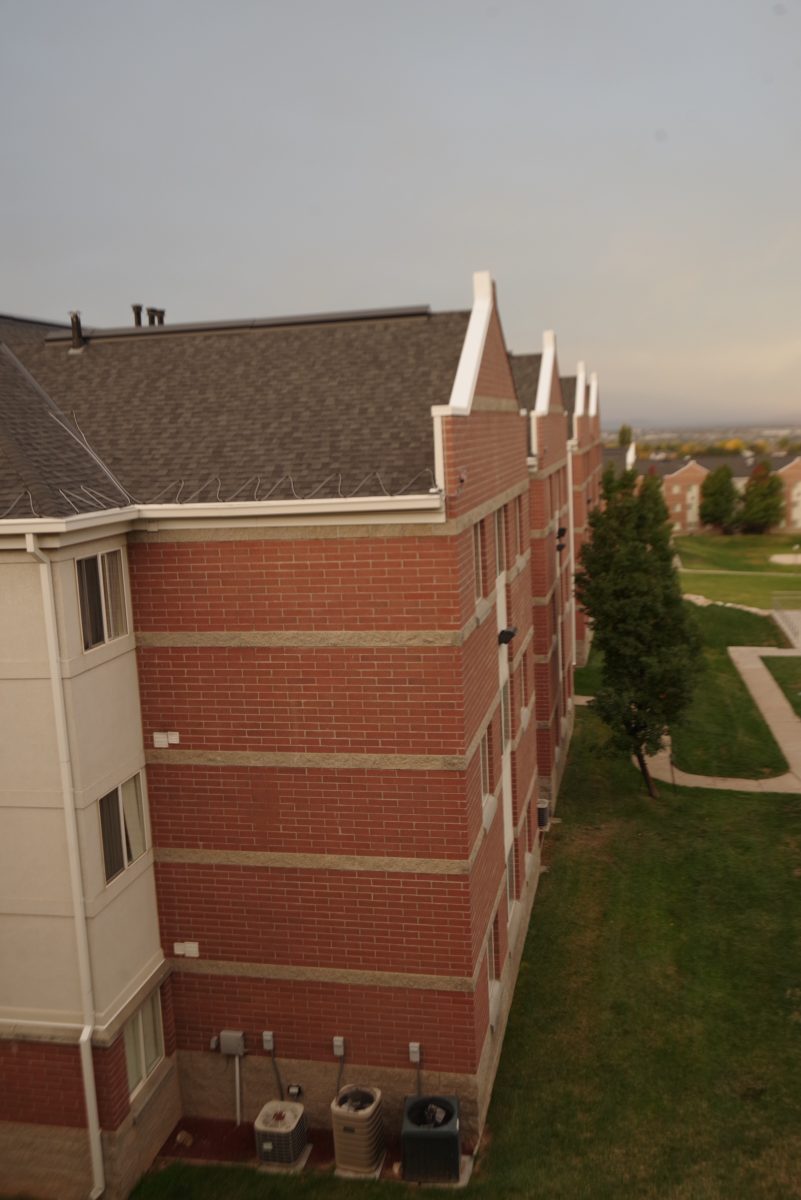 A photo of a housing building located in the Weber State University Village.