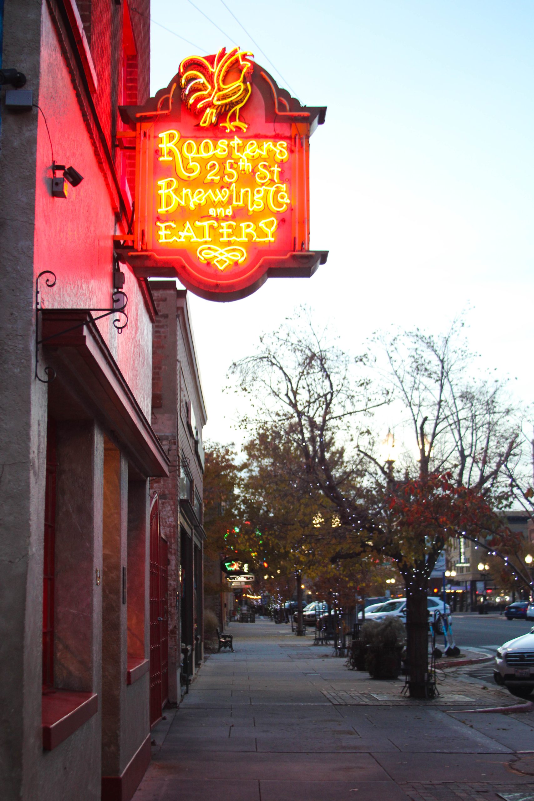 The Roosters Brewing Co. and Eatery sign hanging over its storefront on Historic 25th Street.
