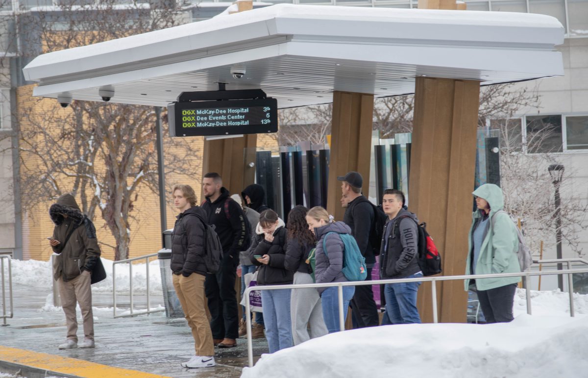 Students await the bus at the OGX station outside of Shepard Union.