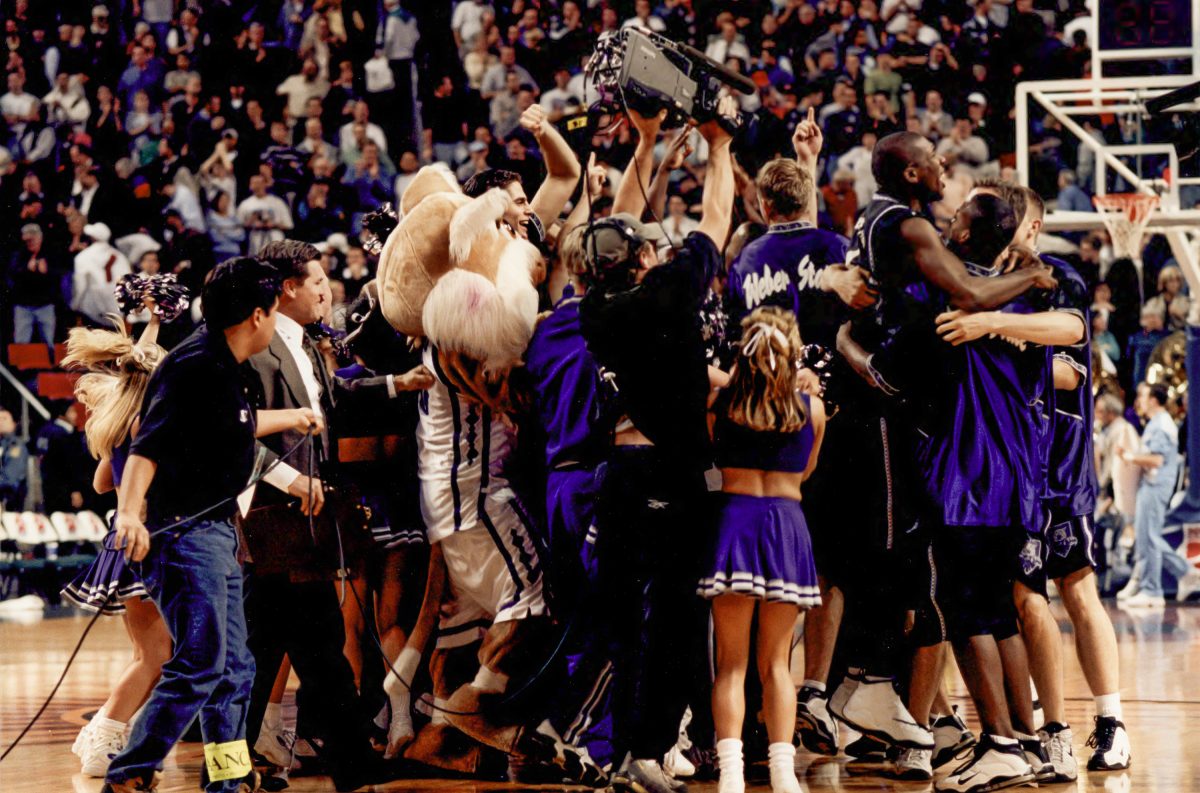 1999+Weber+State+University+Mens+Basketball+team+celebrating+a+win+for+their+final+home+game+and+the+25th+anniversary.