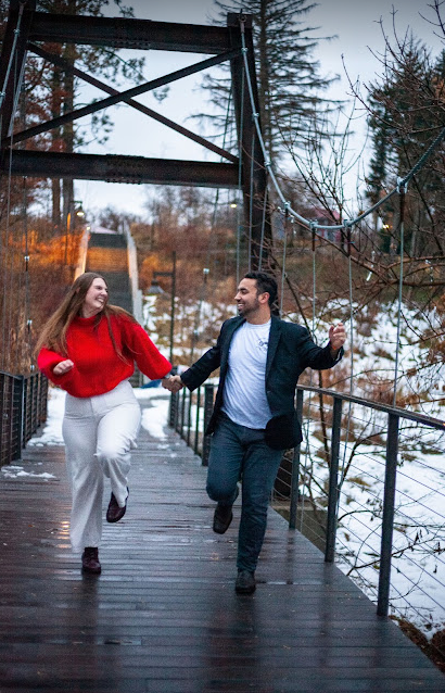 Aurelia Allan and Cole Kelly skipping on a bridge