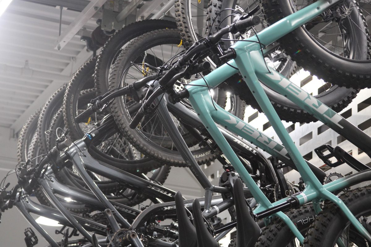 Rental+mountain+bikes+hang+from+bike+racks+inside+of+the+Outdoor+Rec+Center.