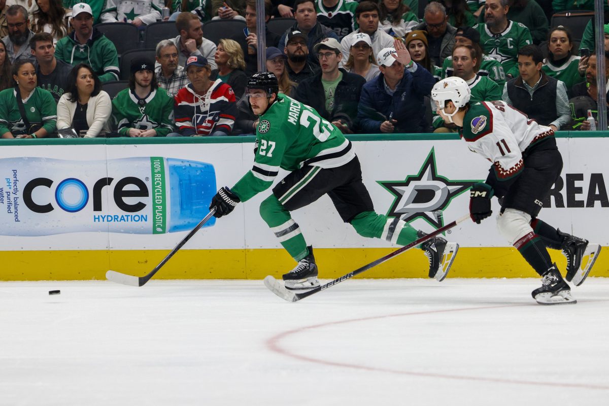 Dallas Stars left wing Mason Marchment (27) skates with the puck ahead of Arizona Coyotes right wing Dylan Guenther (11) during the second period of an NHL game, Wednesday, March 20, 2024, in Dallas.