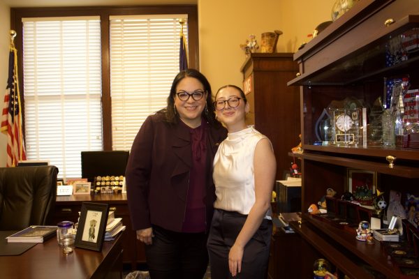 Valentina Rodriguez posing for a photo with Senator Luz Escamilla.