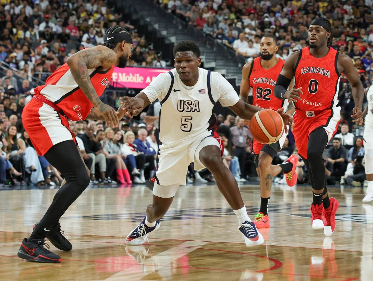 LAS VEGAS, NEVADA - JULY 10: Anthony Edwards #5 of the United States drives against Nickeil Alexander-Walker #1 of Canada in the second half of their exhibition game ahead of the Paris Olympic Games at T-Mobile Arena on July 10, 2024 in Las Vegas, Nevada. The United States defeated Canada 86-72. 