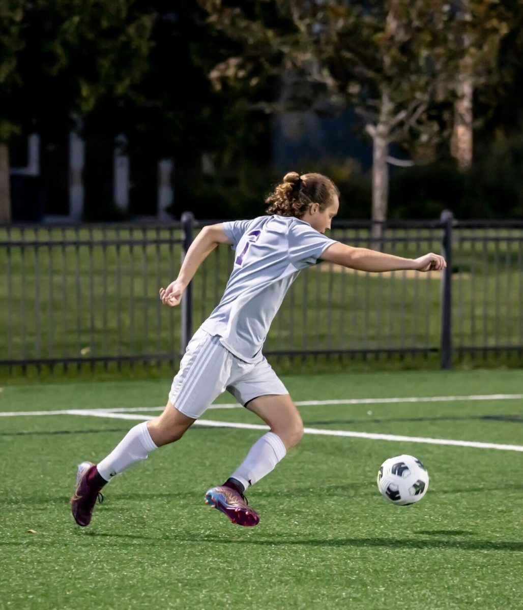 Taggert Ralphs getting ready to kick the ball down the field.