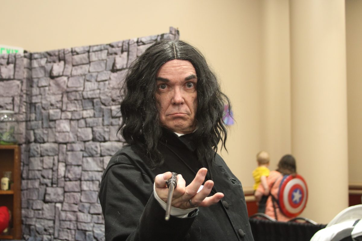 A FanX vendor in character as he cosplays as Professor Snape from the Harry Potter series.