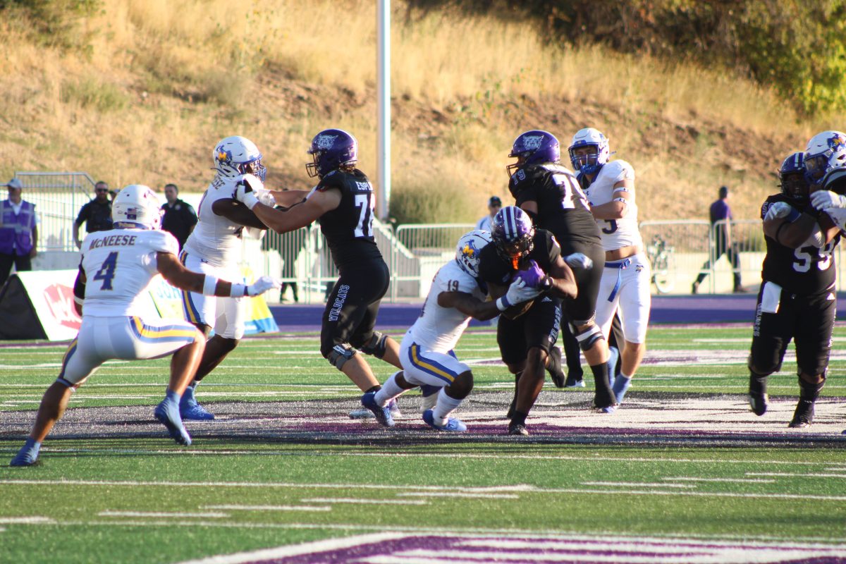 Weber State players attempting to  defend the ball from McNeese players.