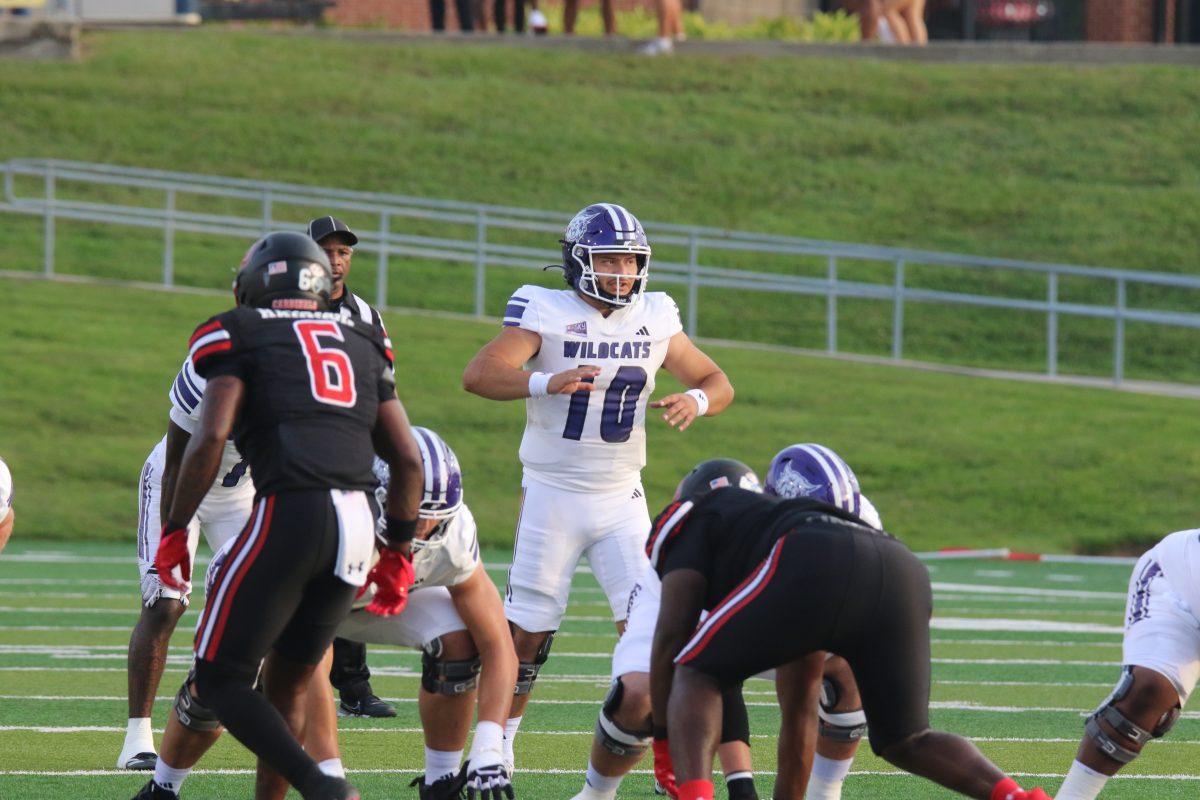 Weber State Quarterback, Richie Munoz (#10), getting ready to line up for a new play against Lamar University.