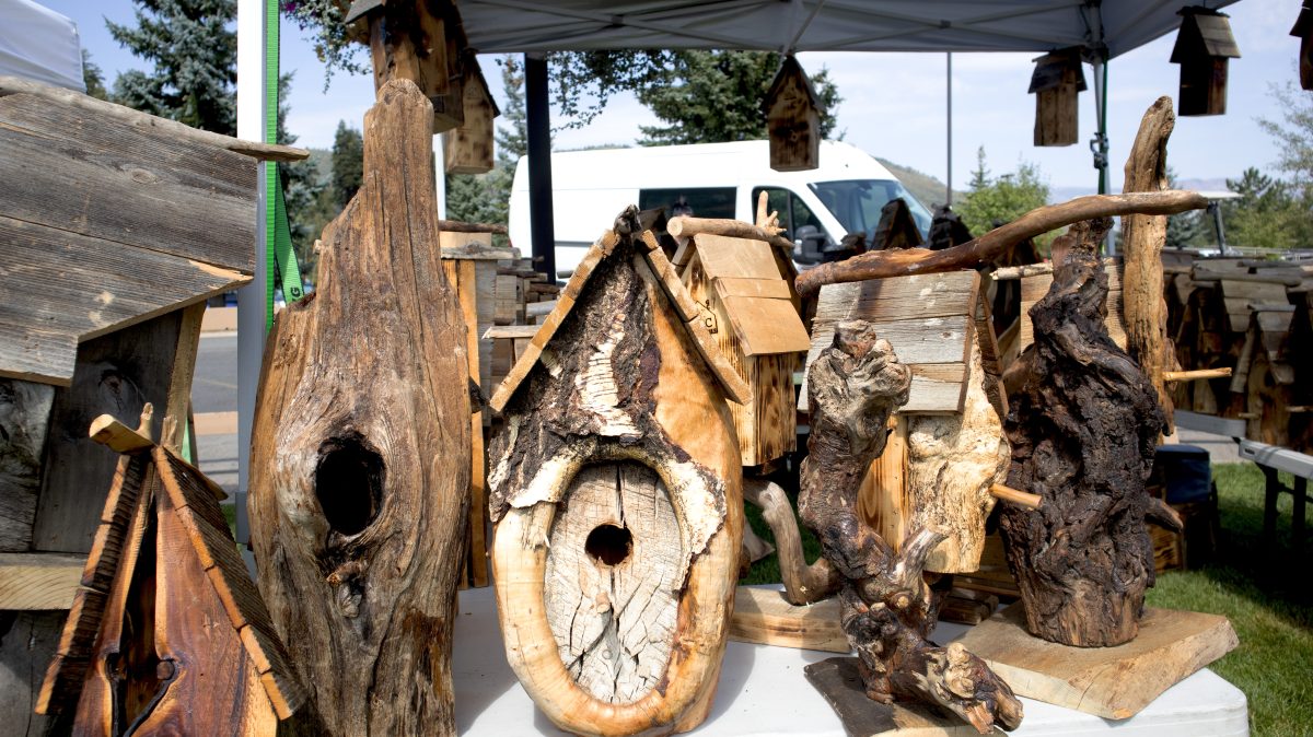 Homemade birdhouses for sale by a local vendor.