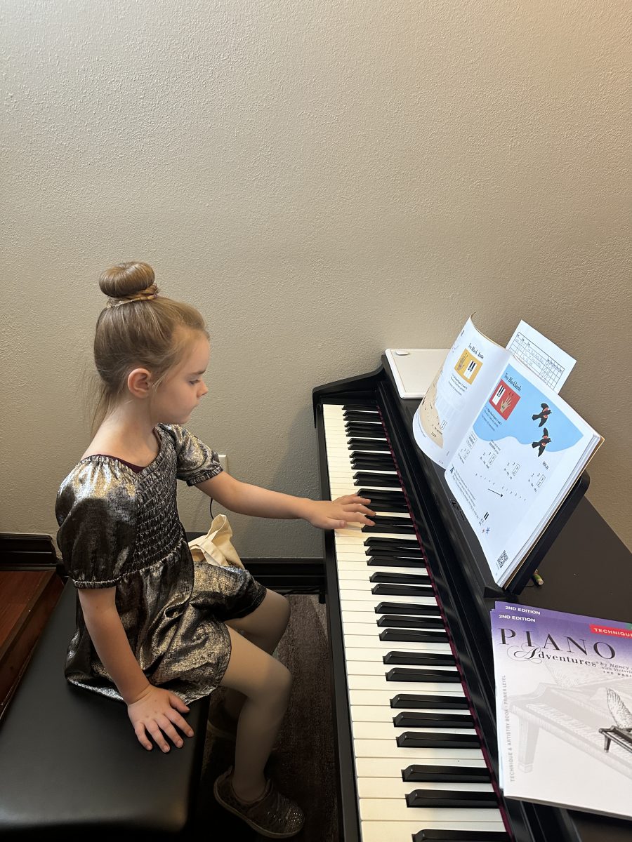 A child participating in Upbeat Performing Arts Piano Private Lessons.