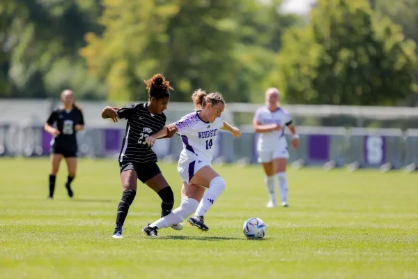 Weber State Women's Soccer Defense, Shea Christiansen (14), dribbling the ball away from the UNLV Rebels.