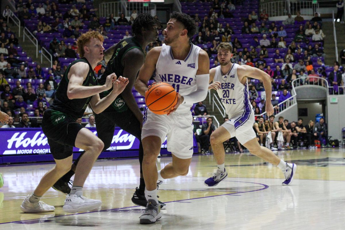 Men's Basketball Guard, Steven Verplancken (11) with the ball.